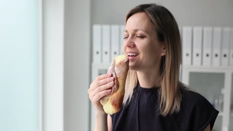 Woman enjoying a sweet pastry