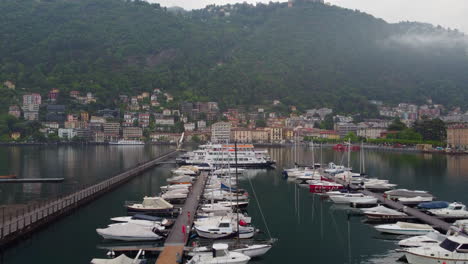 drone shot of a boat harbor at lake como, italy