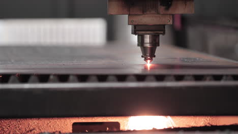 Cutting-Metal-Sheet-With-A-Laser-Cutting-Machine---close-up,-slow-motion