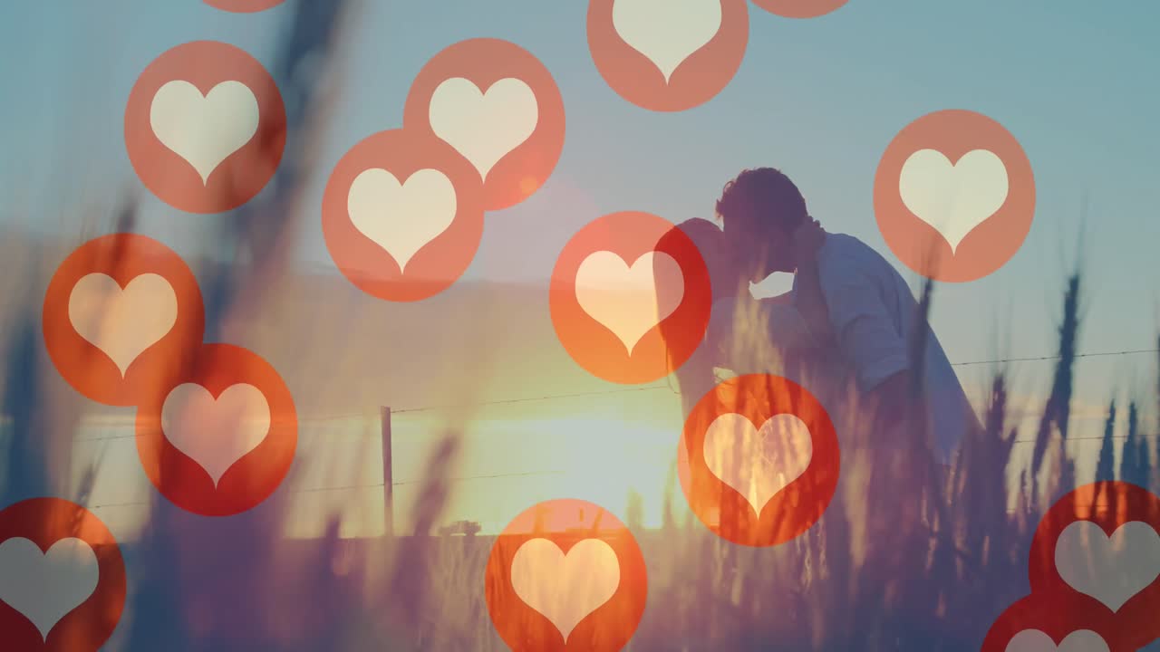 ⁇ 은 커플이 키스하는 것에 대해 떠다니는 여러 개의 빨간 심장 아이콘