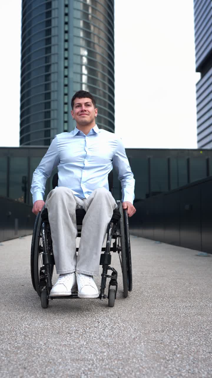 Smiling Man in Wheelchair Against Modern Skyscrapers