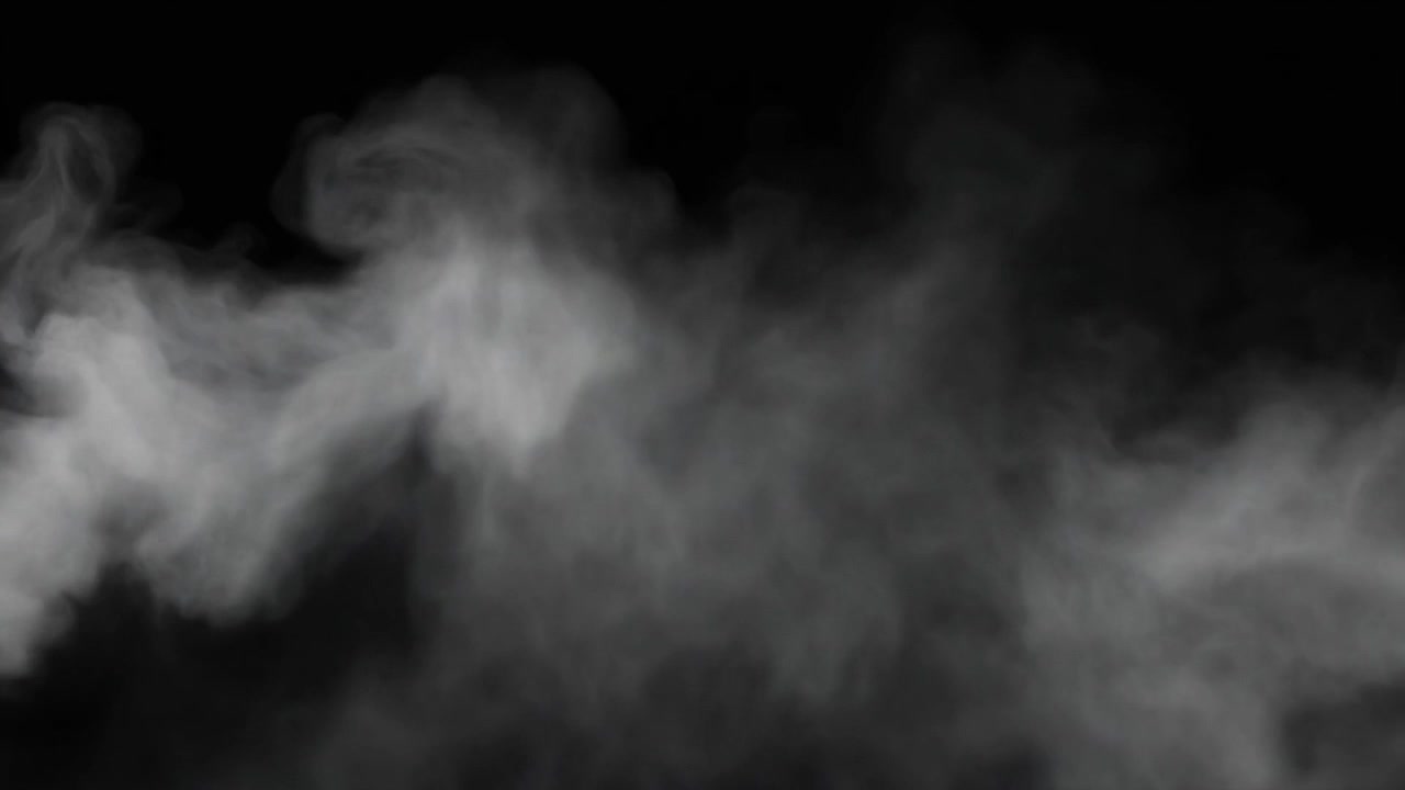 Humo blanco elevándose contra un fondo negro