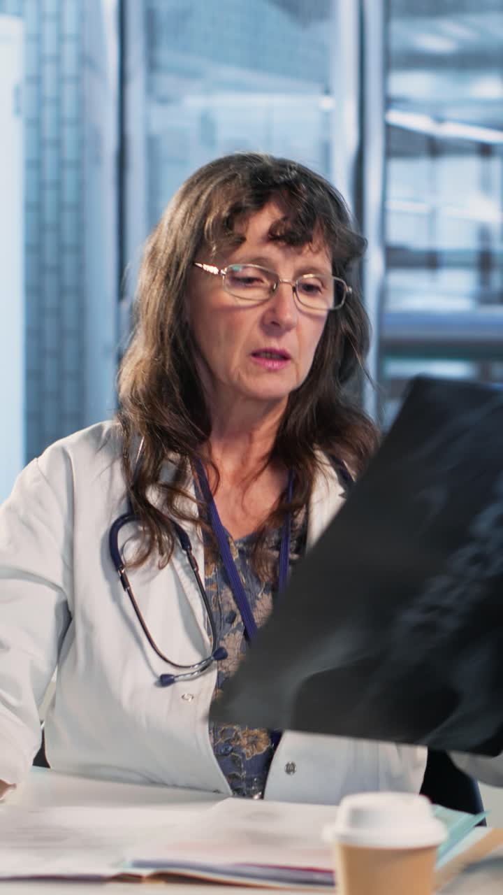 Vertical Video Medic gives a bad concerning diagnosis to elderly patient at checkup