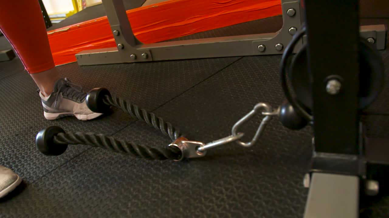 Woman giving up of doing exercises and drop the handle on the floor. Slow Motion