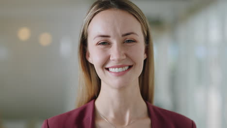portrait-happy-caucasian-business-woman-smiling-enjoying-successful-career-proud-entrepreneur-in-office-workplace-testimonial-4k-footage