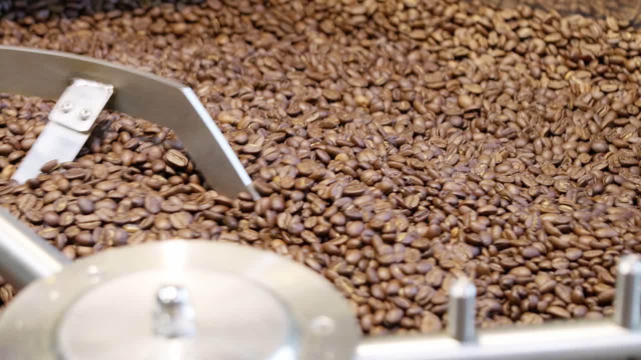 Explore the intricate process of roasting coffee beans in a vibrant coffee shop environment.