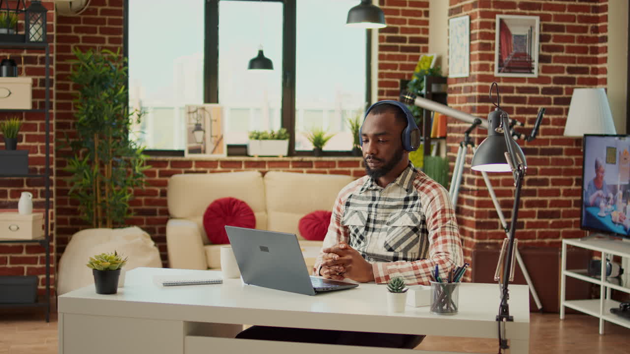 Businessman attending online videoconference meeting