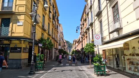 pedestrians walking along a vibrant street