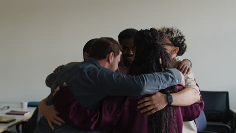 diverse team in a supportive group huddle
