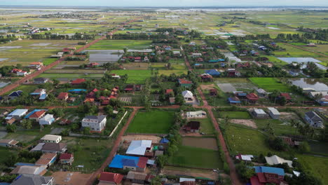 farm houses spread across cambodian countryside near siem reap