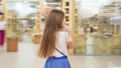 girl running in a supermarket
