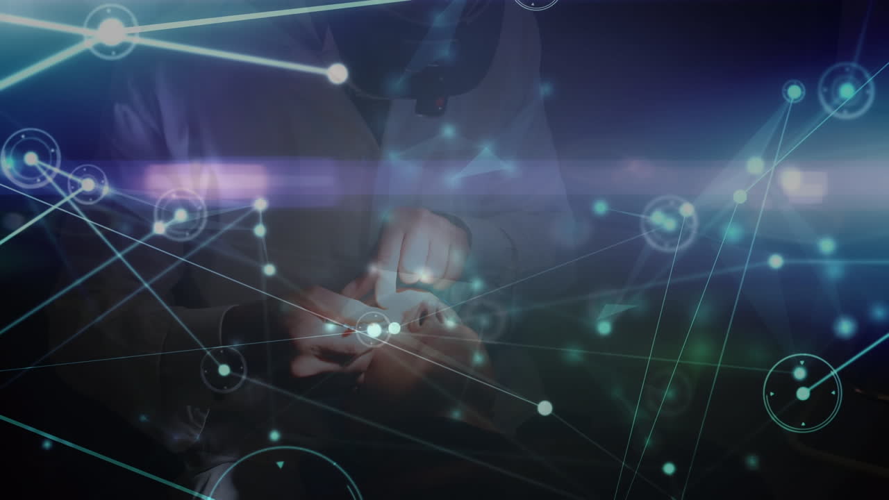 Animation of network of connections over hands of caucasian male eye doctor and patient