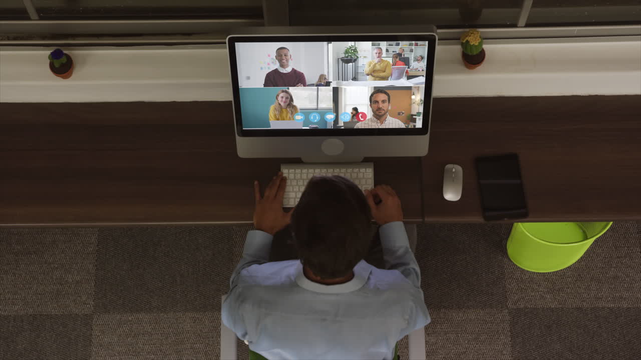 Overhead view of man having a video conference