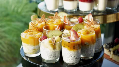 colorful sweet desserts with fruit mousse, strawberries, and kiwi