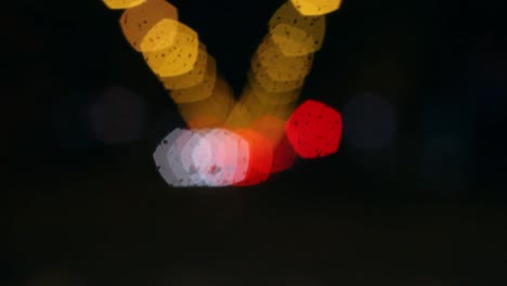 out of focus car and traffic lights