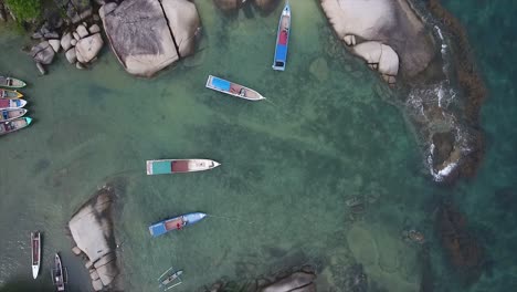 fishing vessels are leaning, zoom in shot from drone