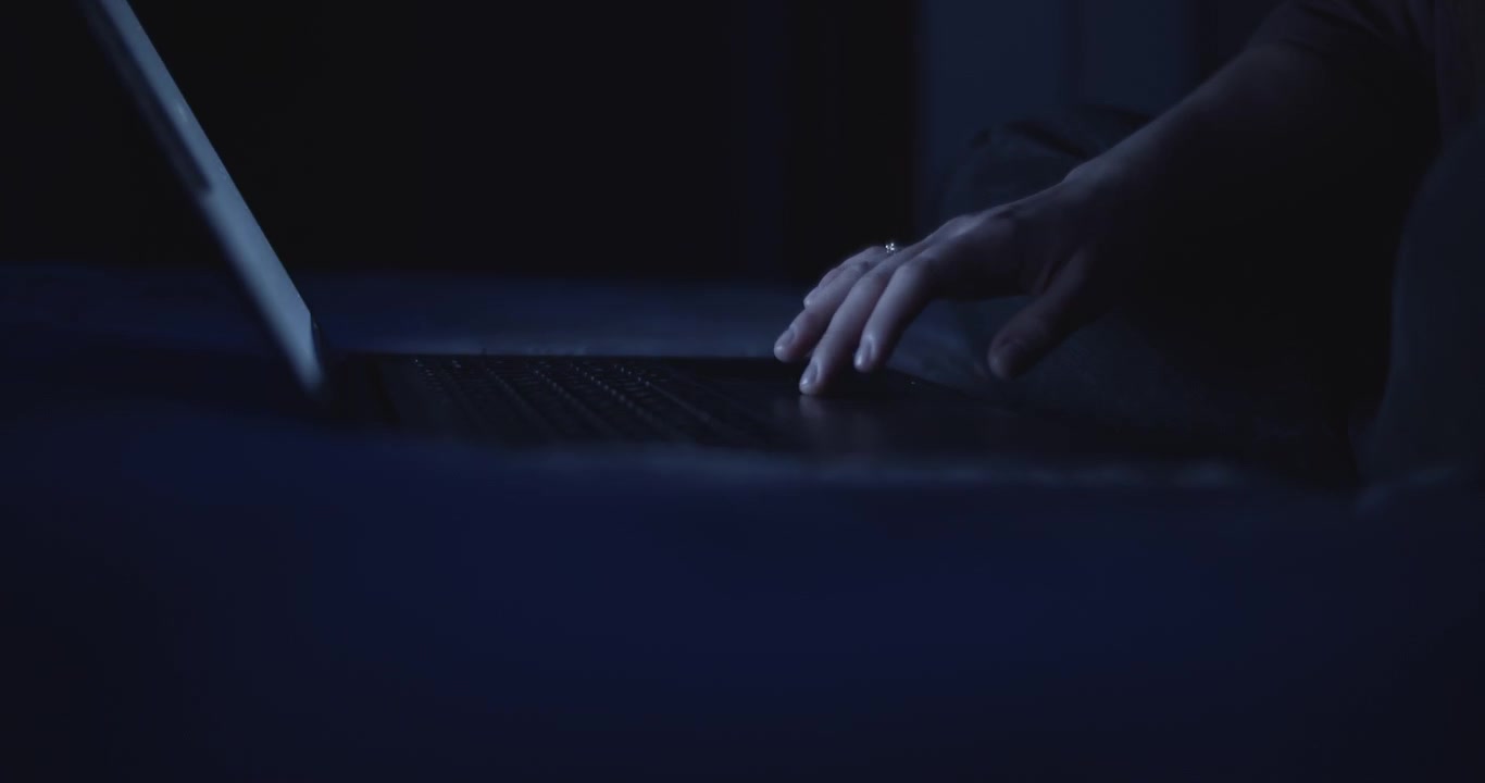 Woman's hand using a laptop's touchpad