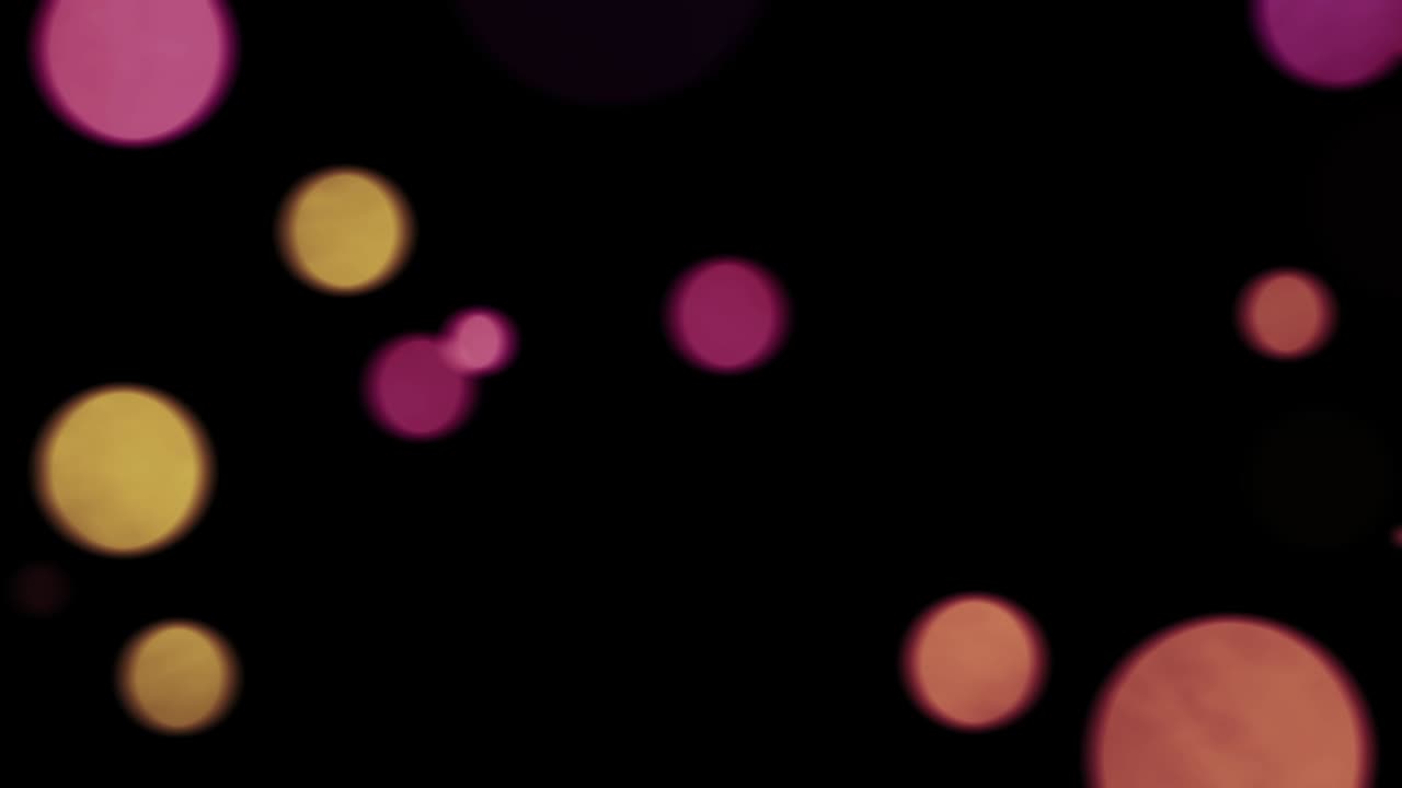 Abstract Seamless loop multi color bokeh lights. Christmas light texture background. Motion graphics. Festive background. 4K Floating particles Multicolored on black endless loop footage.