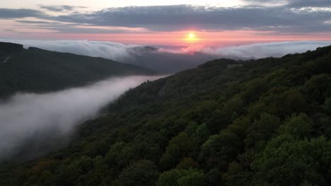 aerial-push-in-to-sunrise-over-mountains-near-boone-and-blowing-rock-nc,-north-carolina-in-the-appalachian-mountains