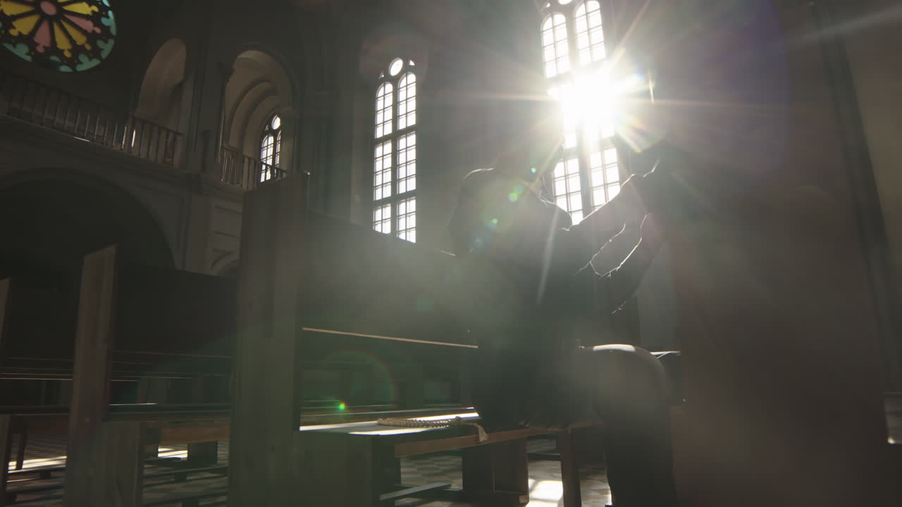 African Clergyman Reading Bible in Christian Church
