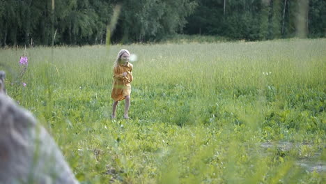 pure joy in the face of a child running barefoot in summer grass