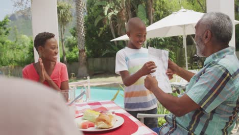 Happy-family-eating-together-at-table