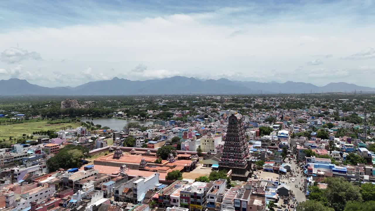 Aerial view of Tenkasi, Tamil Nadu, with the grand Kasi Viswanathar Temple at its center. The temple's impressive gopuram rises above the town's tightly packed Dravidian buildings