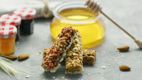 Cereal-bars-and-honey-in-arrangement