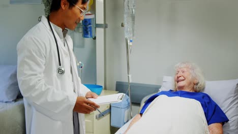 male doctor interacting with senior patient 4k