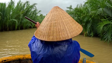 calm of the river, each gentle sway, wearing a non la in the vietnamese way