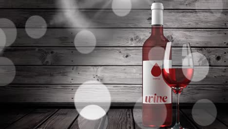 Animation-of-lights-over-bottle-and-glass-of-rose-wine-over-wooden-background