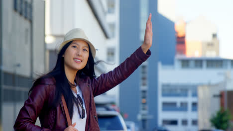 woman hitchhiking in city street 4k