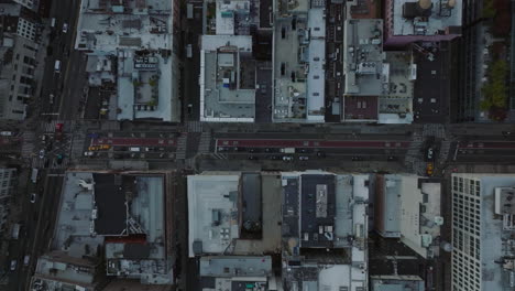 Aerial-birds-eye-overhead-top-down-panning-view-of-vehicles-driving-in-city-streets.-Manhattan,-New-York-City,-USA