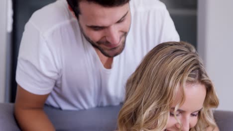 Man-looking-over-his-wife-shoulder