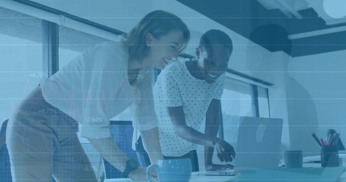 Two female colleagues discussing a business project on a laptop