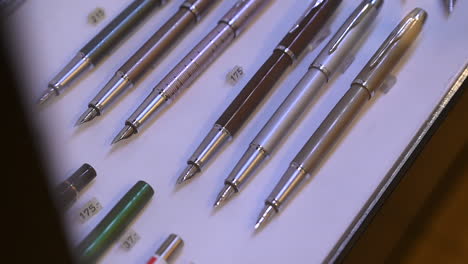 exploring the artistry of fountain pens, fountain pens are on display for sale