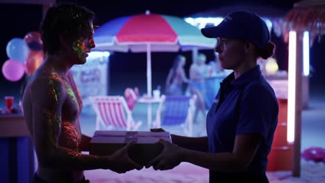 a captivating scene unfolds as two characters share an intriguing moment in a glowing, vibrant setting, filled with colors and the exchange of a mysterious package