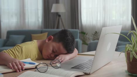 tired child sleeping during online class