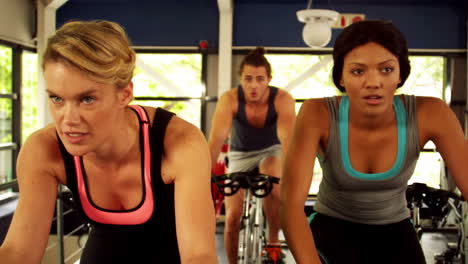 fitness group working out on exercise bike