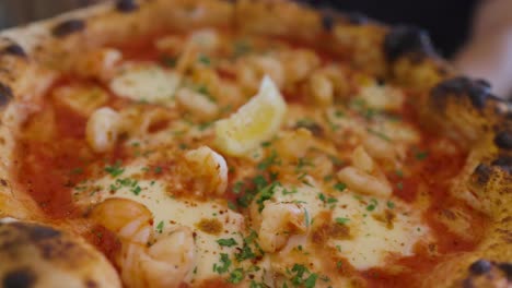 delicious prawn pizza with lemon slice