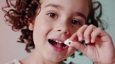 a young girl smiling and showing her lost tooth