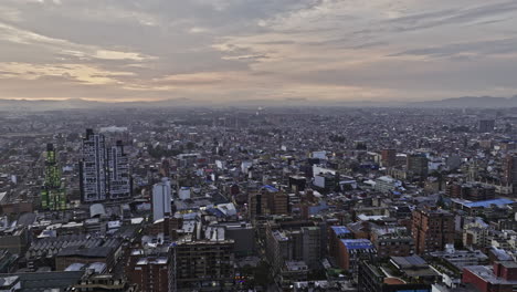 bogota colombia aerial v12 panoramic views drone flyover la salle and san luis neighborhoods capturing beautiful cityscape with sun setting on the city skyline - shot with mavic 3 cine - november 2022