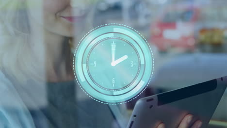 animation of clock moving over hands of caucasian businesswoman using tablet