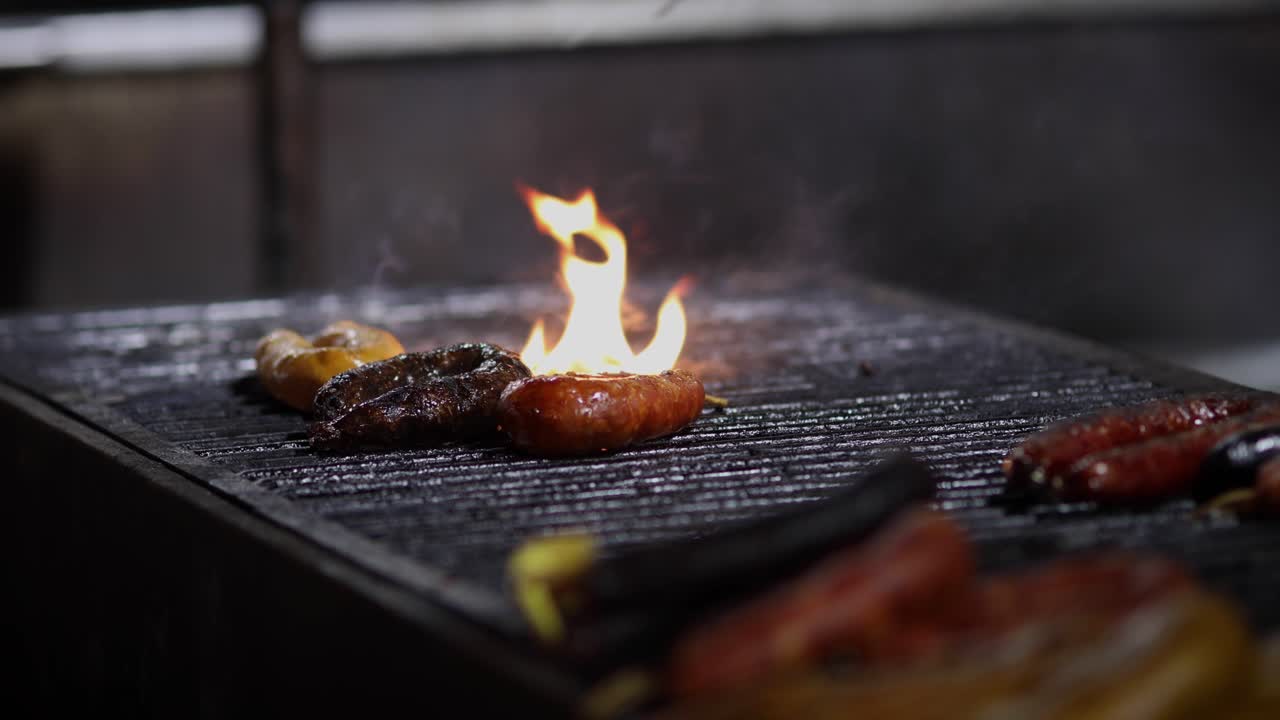 Street Food. Portuguese traditional spicy sausage being barbecued over hot charcoal fire
