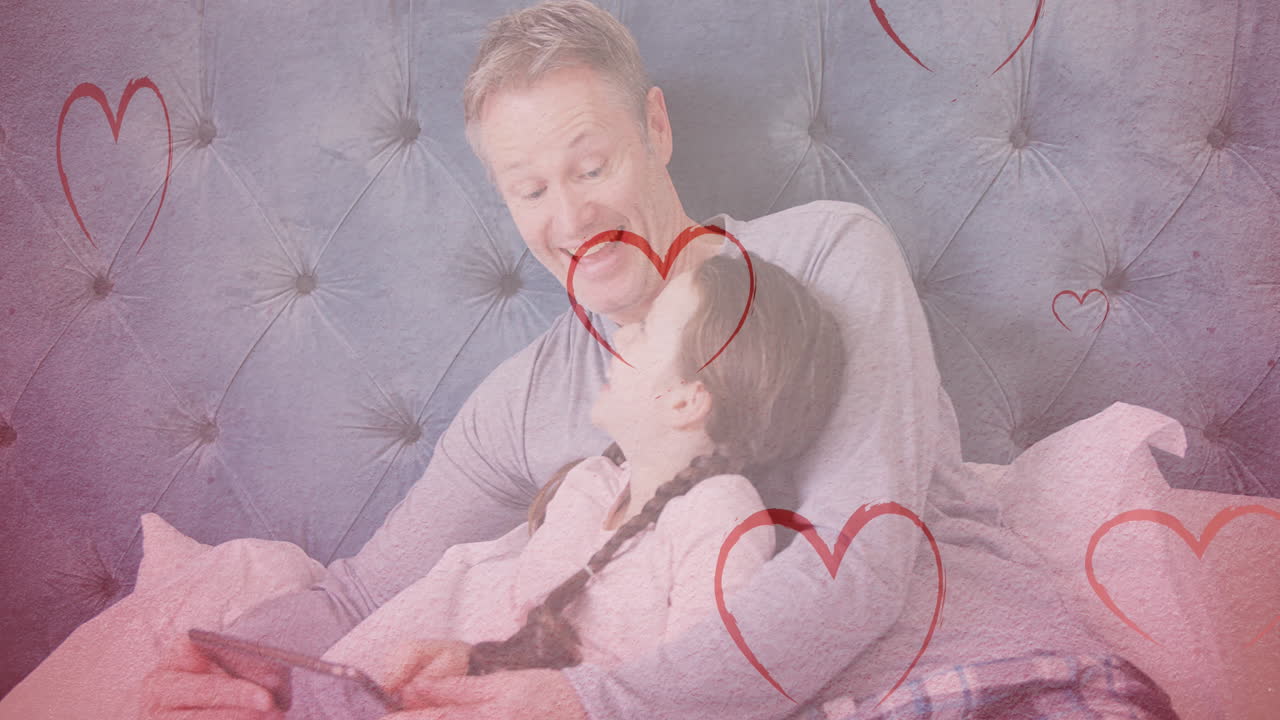 태블릿을 사용하여 백인 남성과 그의 딸에게 떨어지는 마음의 애니메이션