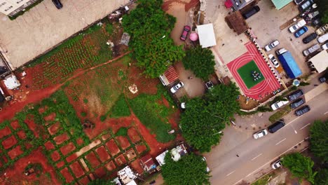 aerial view of a community in africa with farmland and playground