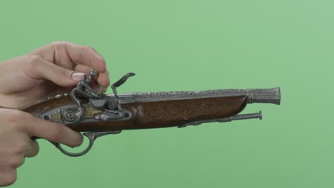 antique pistol in hand