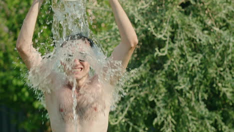 man getting water poured on him