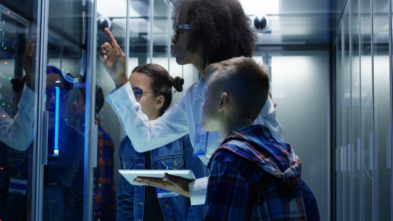 Kids learning about technology in a server room