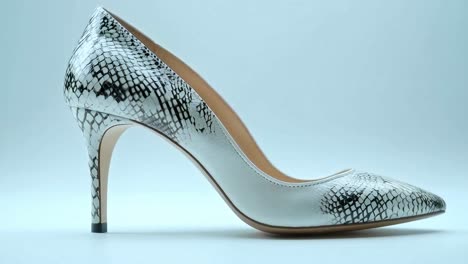 snakeskin patterned high heel shoe